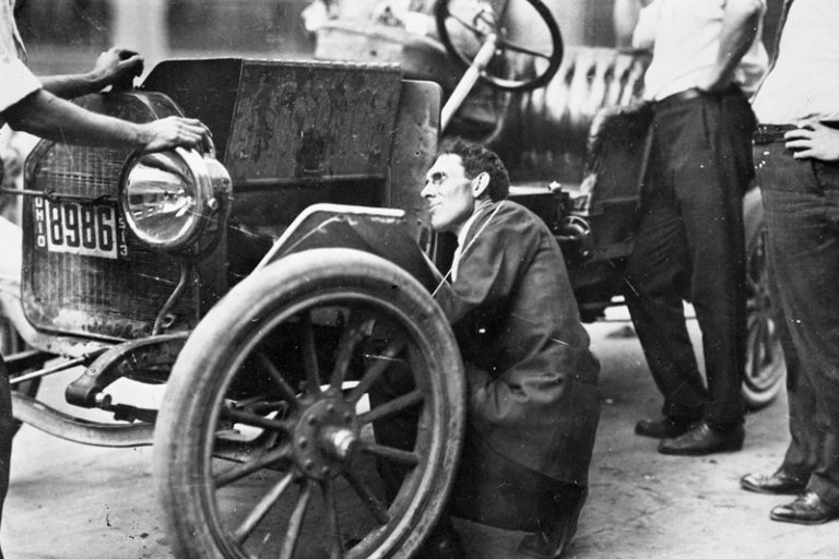 charles kettering fixing car old black and white photo